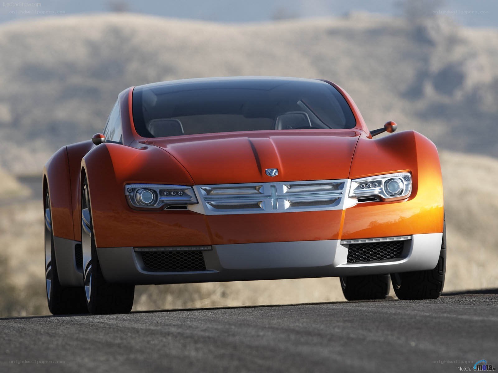 orange concept car on road