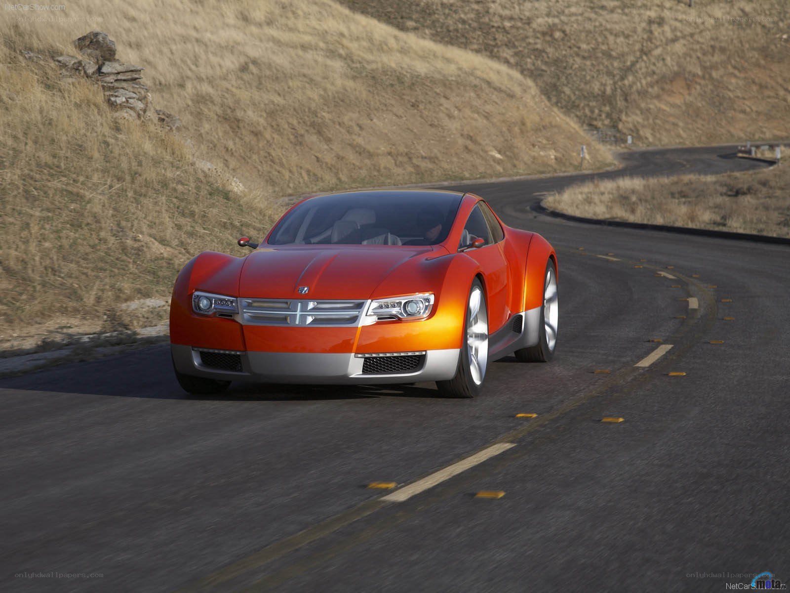 orange concept car on road