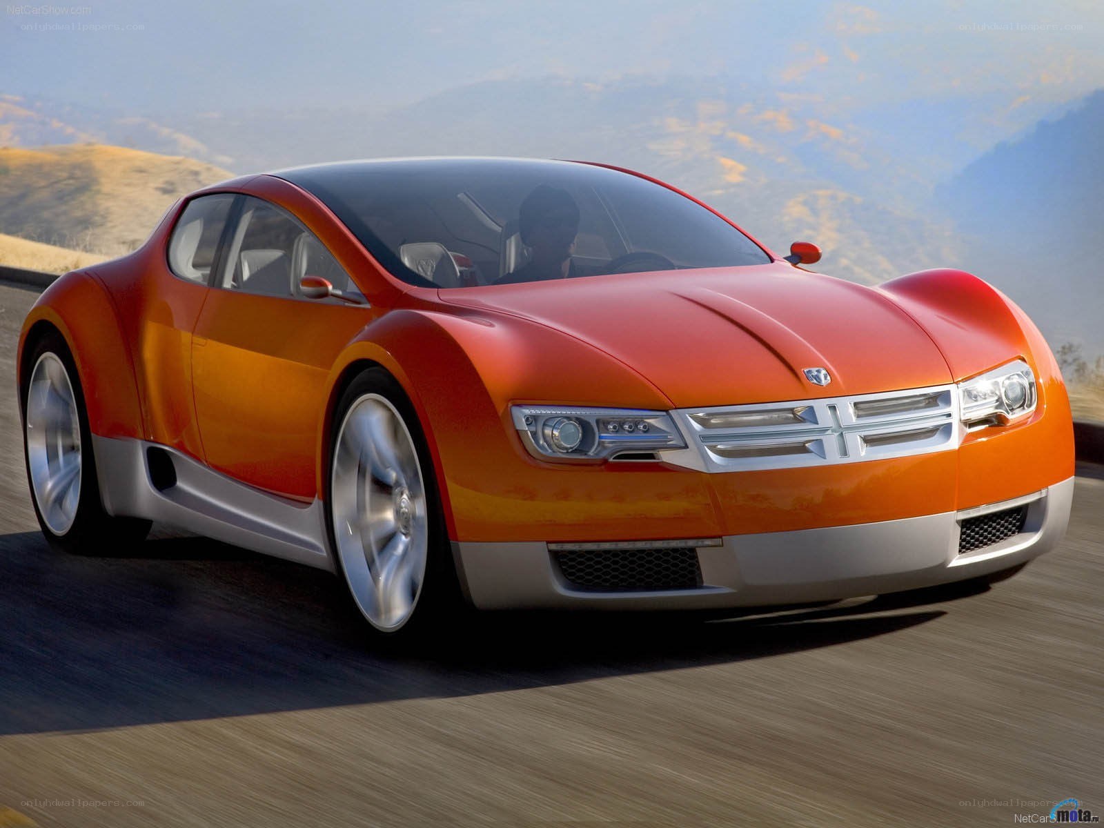 Orange concept car on road
