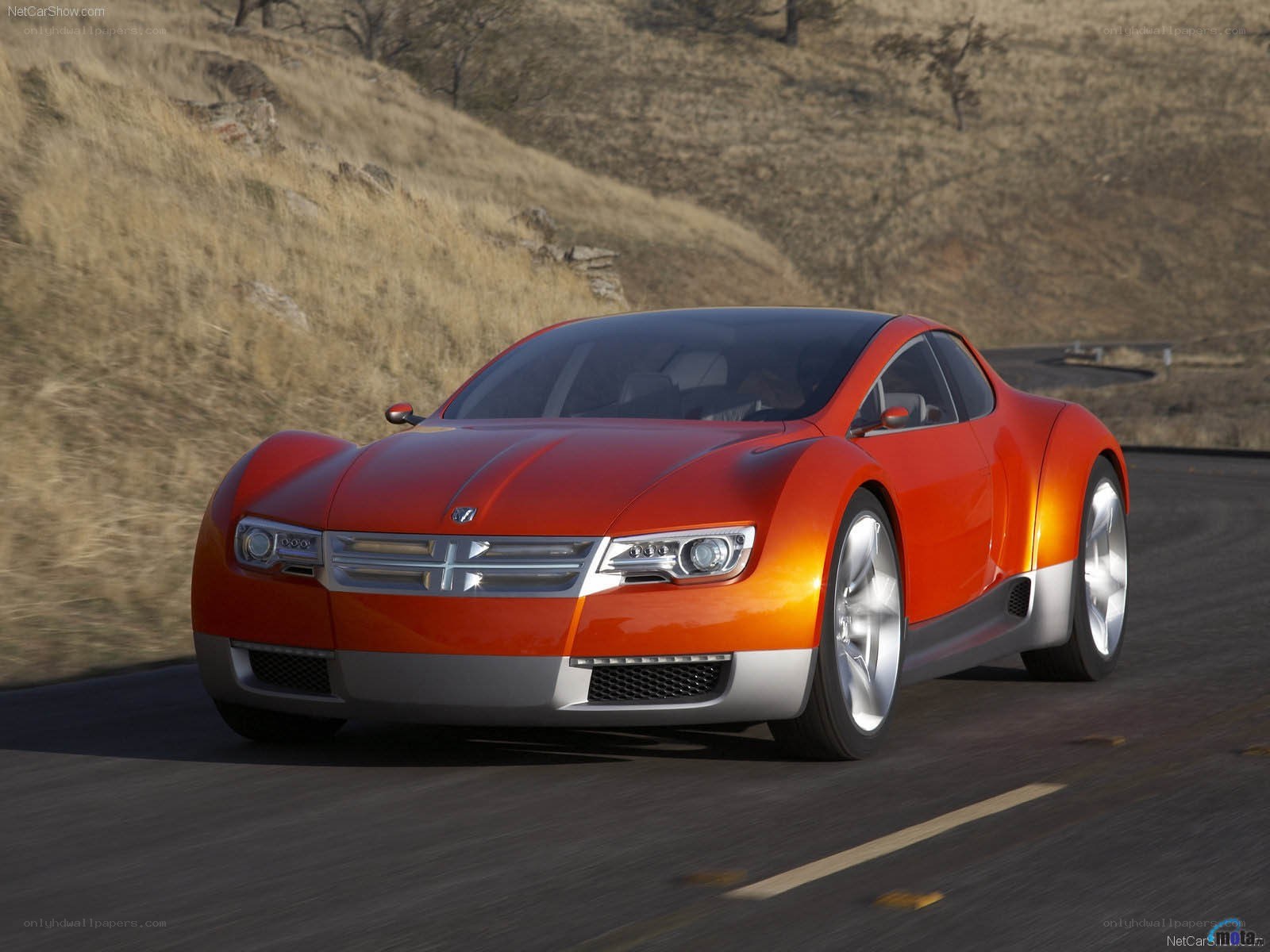 orange concept car on road