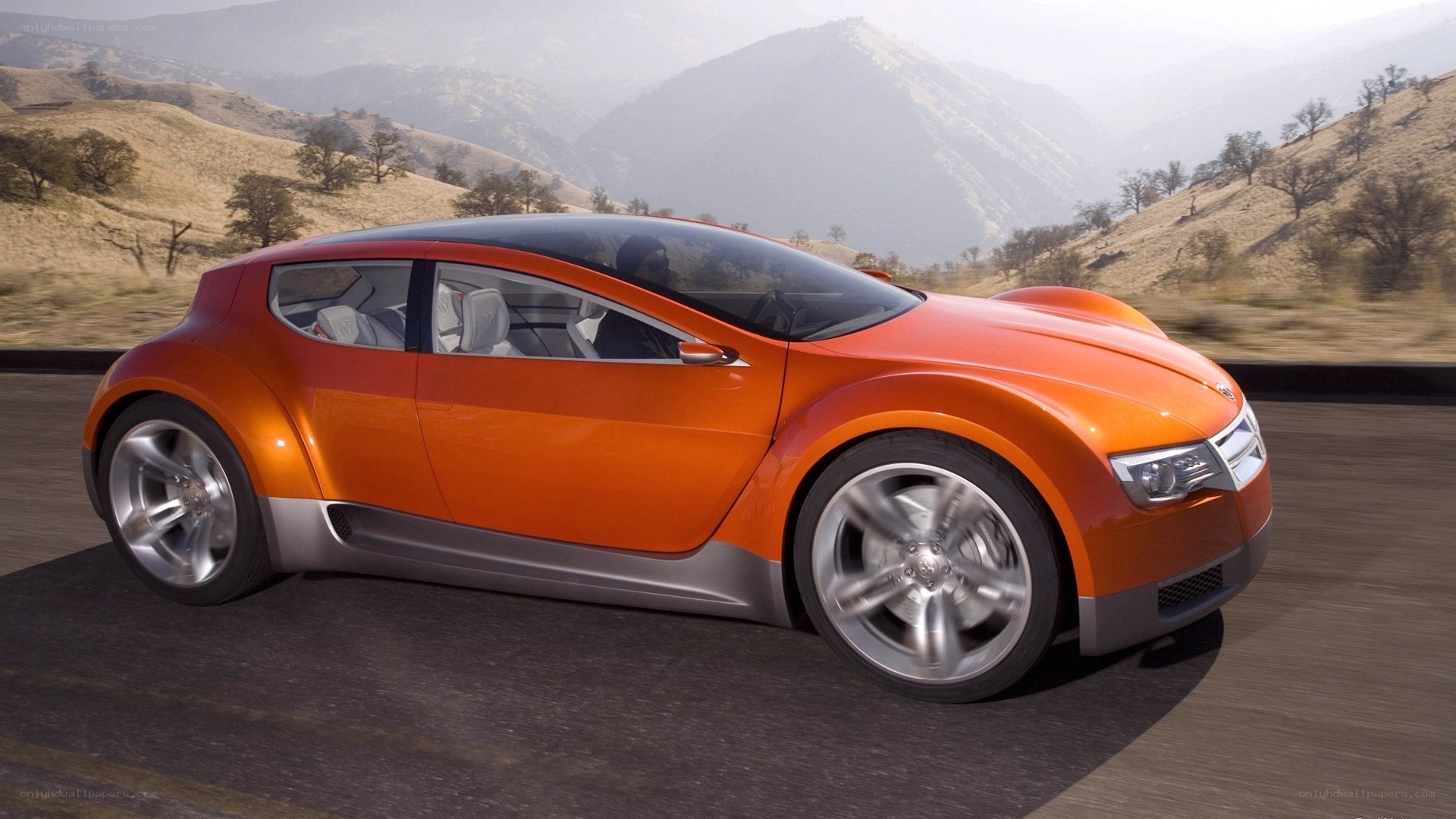 orange concept car on road
