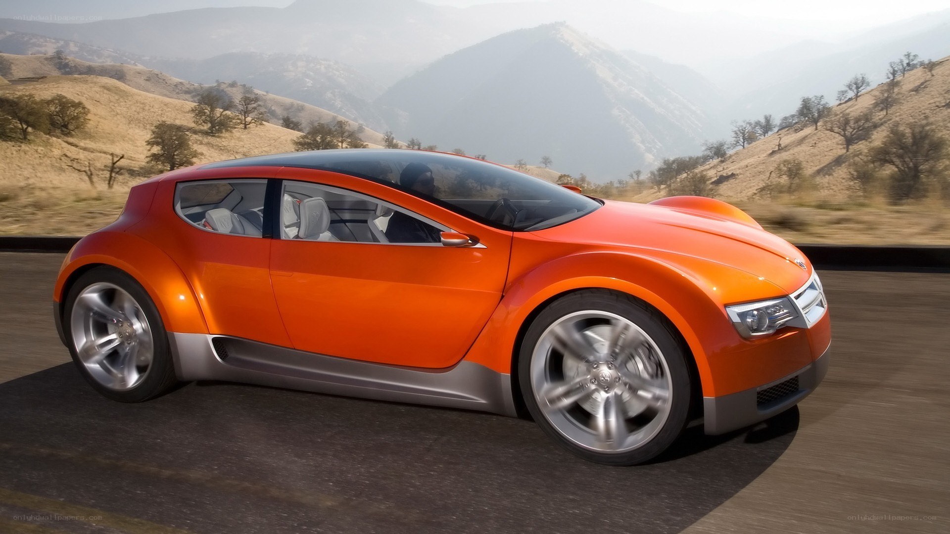 orange concept car on road