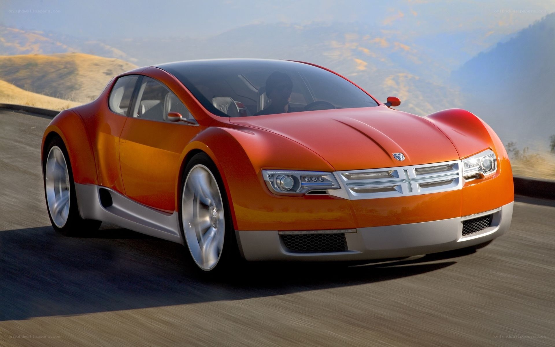 Orange concept car on road