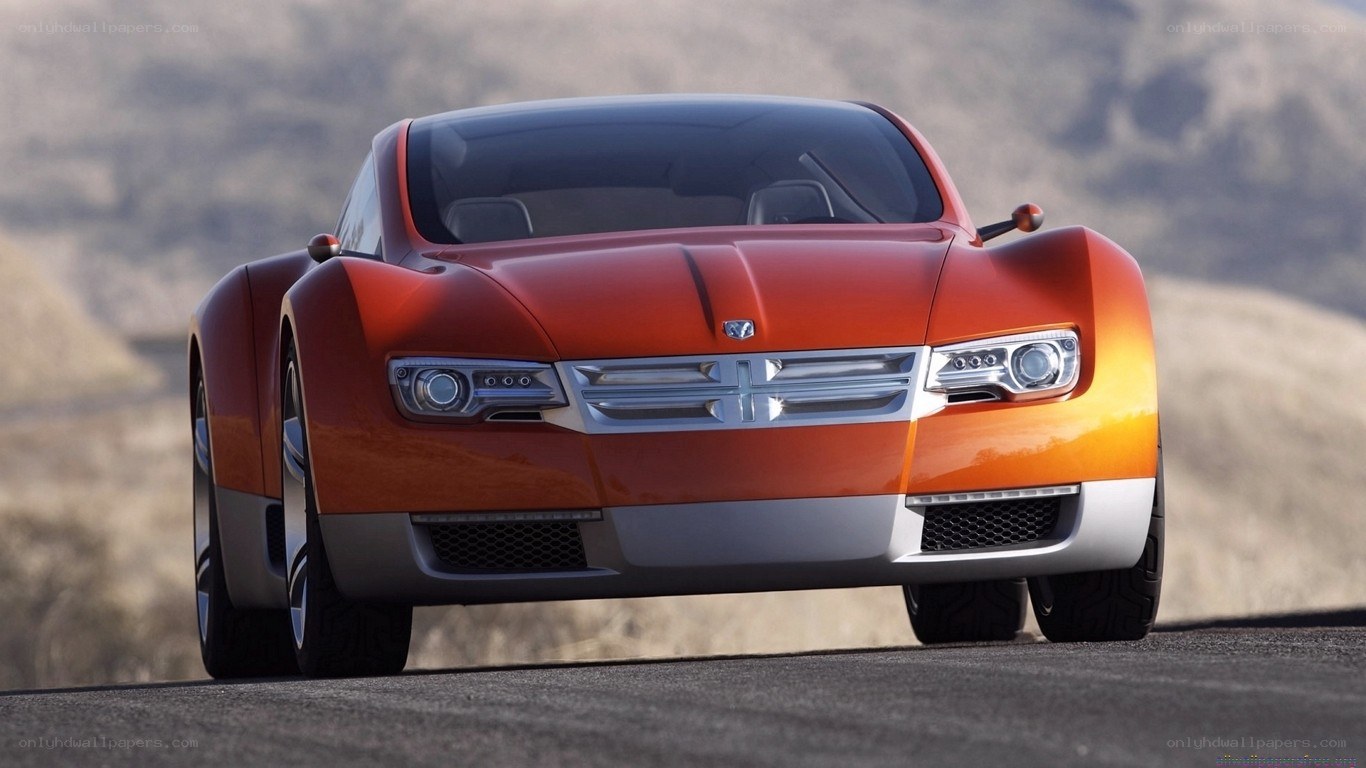 orange concept car on road
