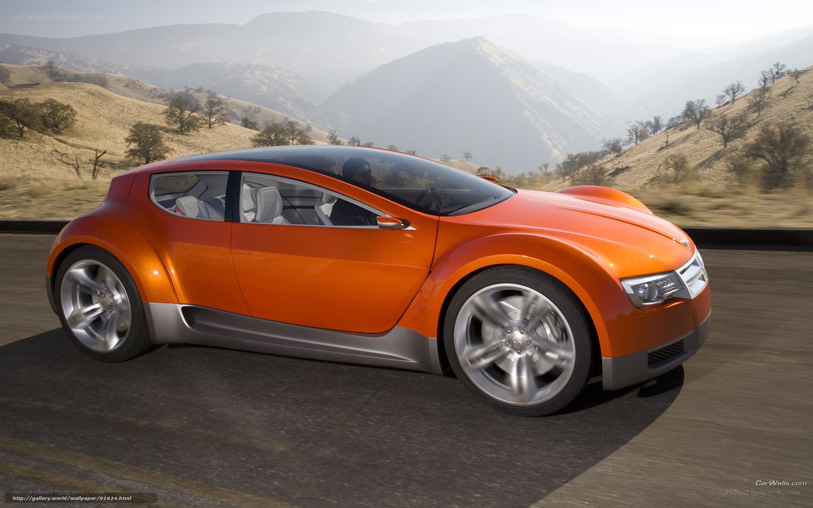 orange concept car on road