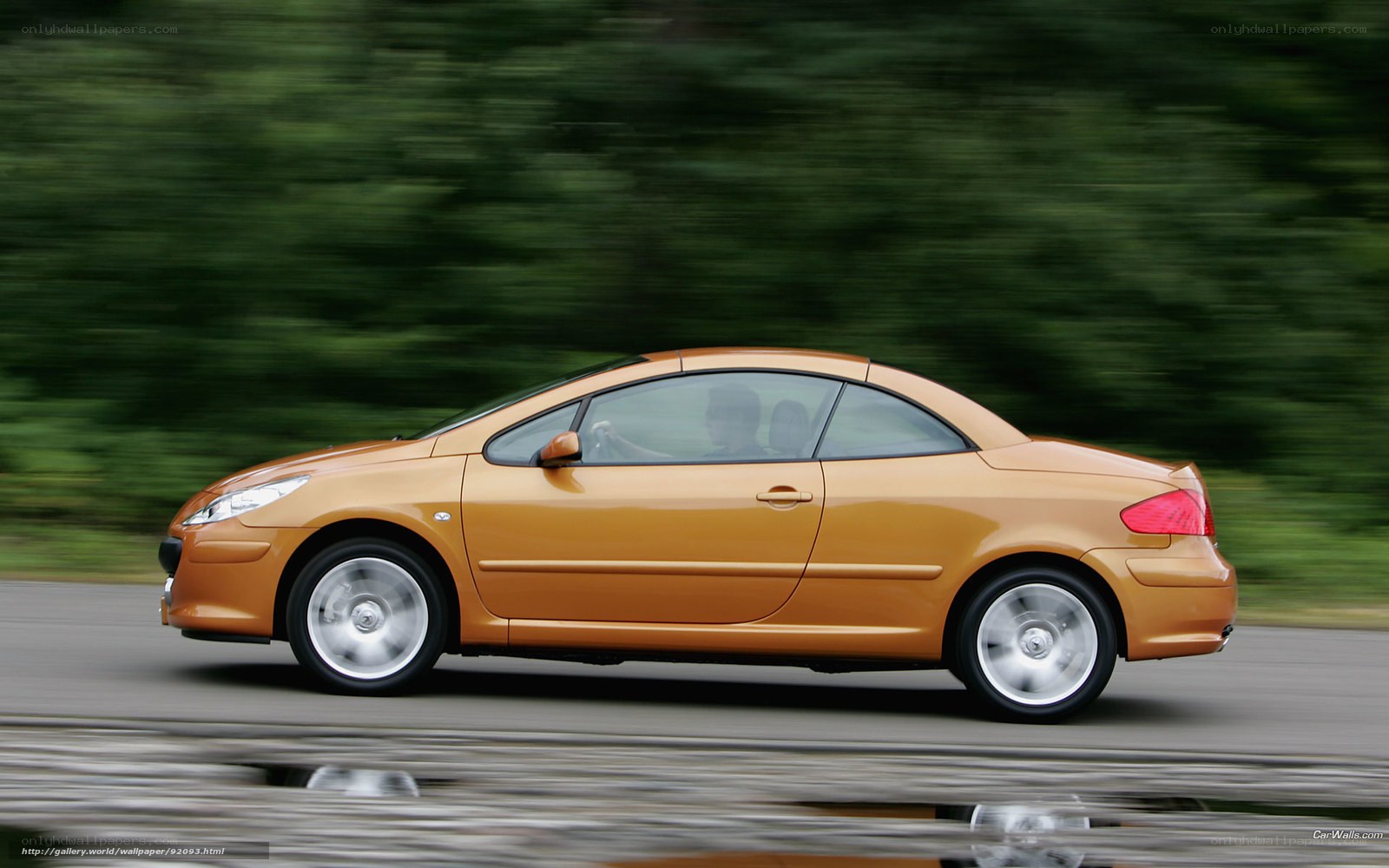 orange convertible car in motion