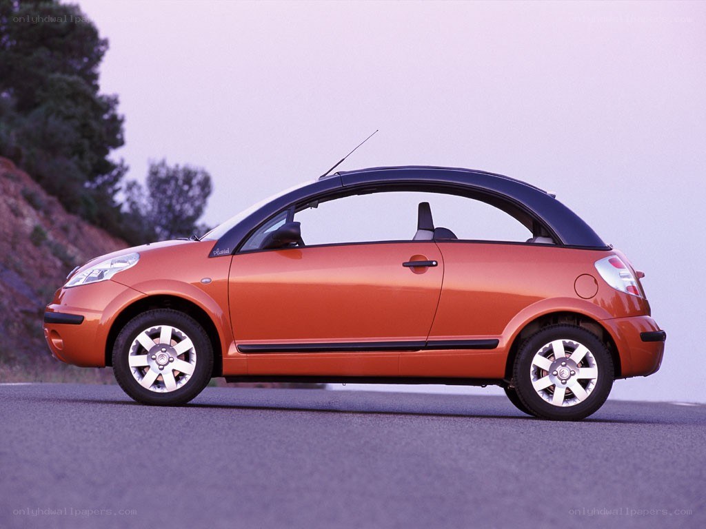 orange convertible car on road
