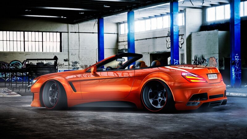 Orange convertible in warehouse