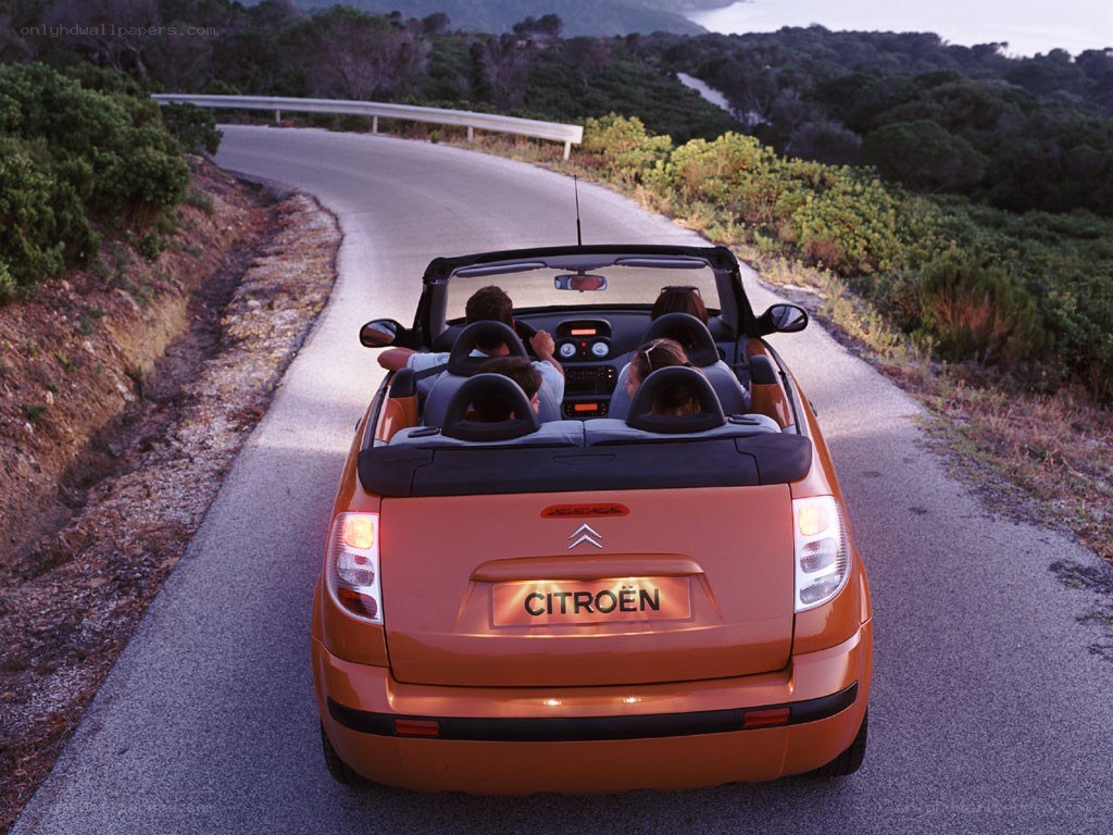 Orange convertible on winding road