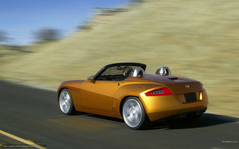 Orange convertible sports car in motion
