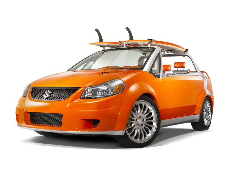 Orange convertible with surfboard
