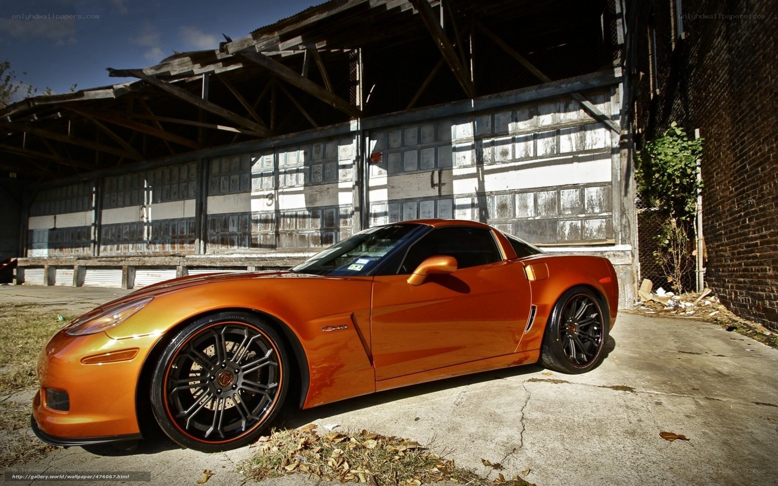 Orange Corvette in an old warehouse
