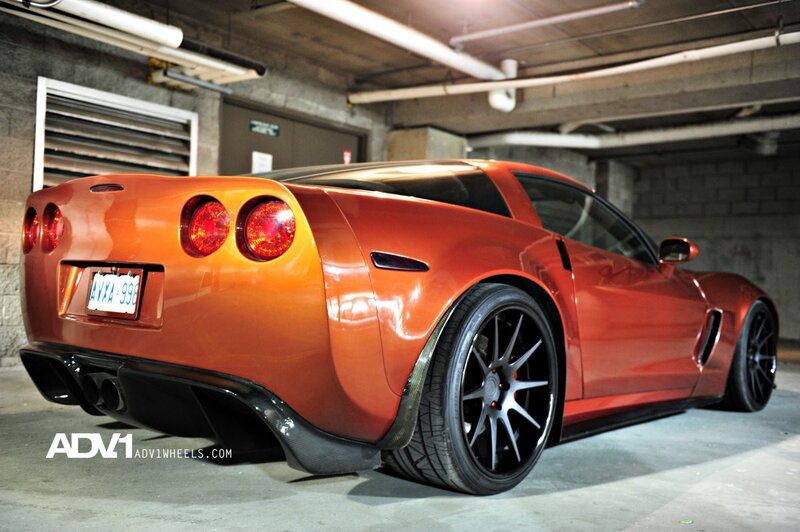 orange corvette in garage