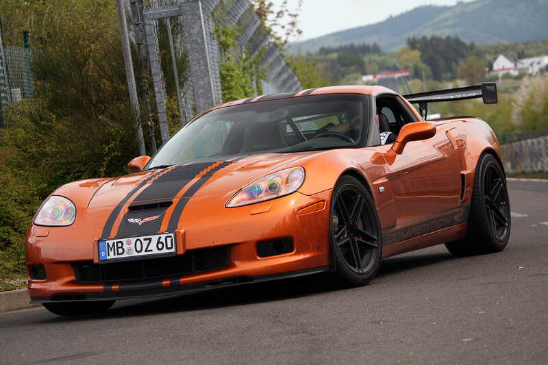 Orange Corvette on a racetrack