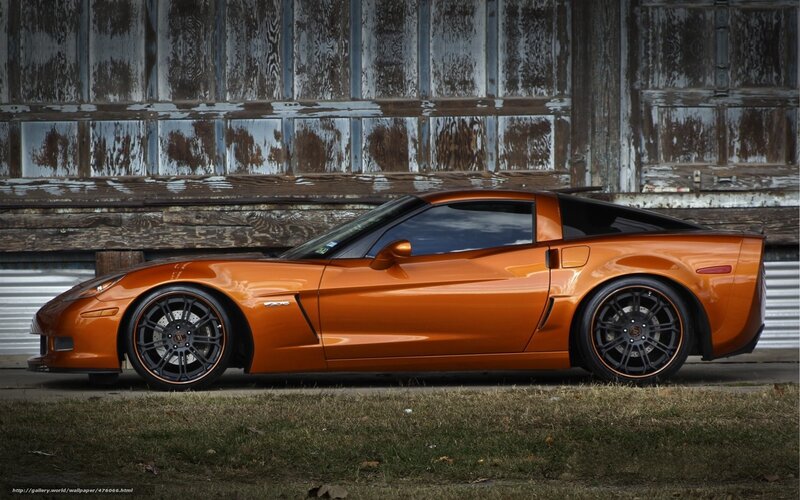 Orange Corvette Sports Car — Dramatic, Photograph, Building