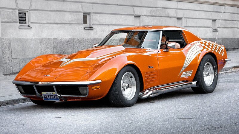 Orange Corvette Stingray on city street
