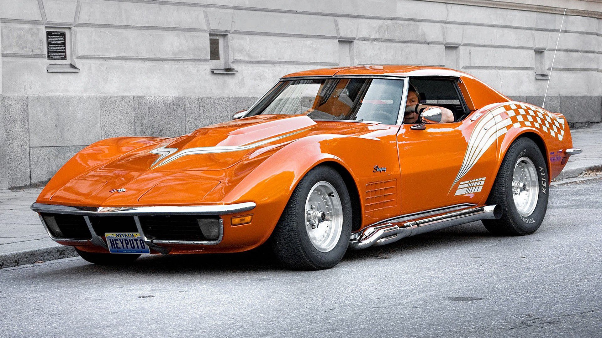 Orange Corvette Stingray on city street