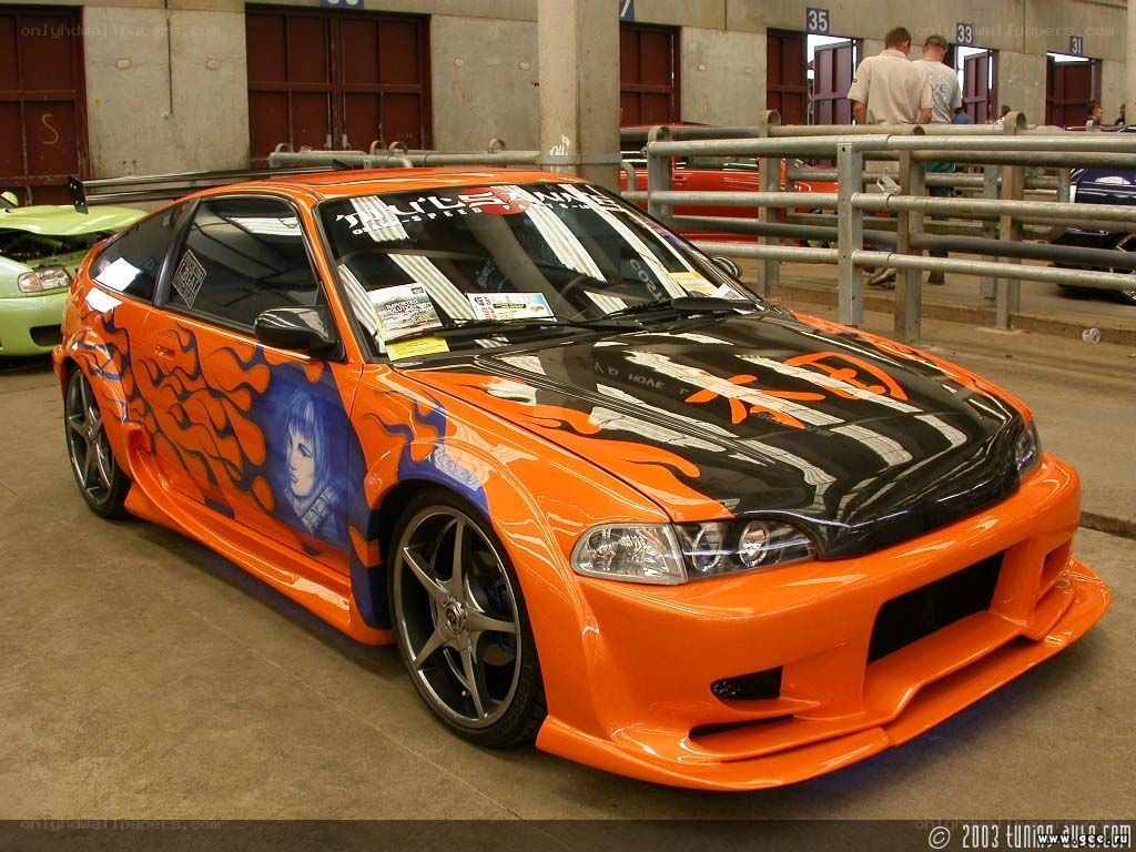 orange custom car with anime art