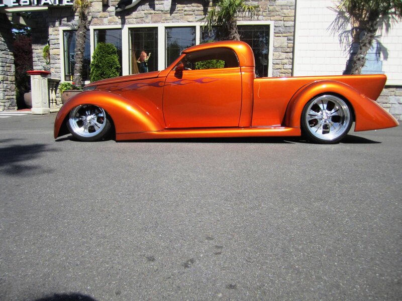 Orange Custom Pickup Truck — Calm, Afternoon, Photograph, Building