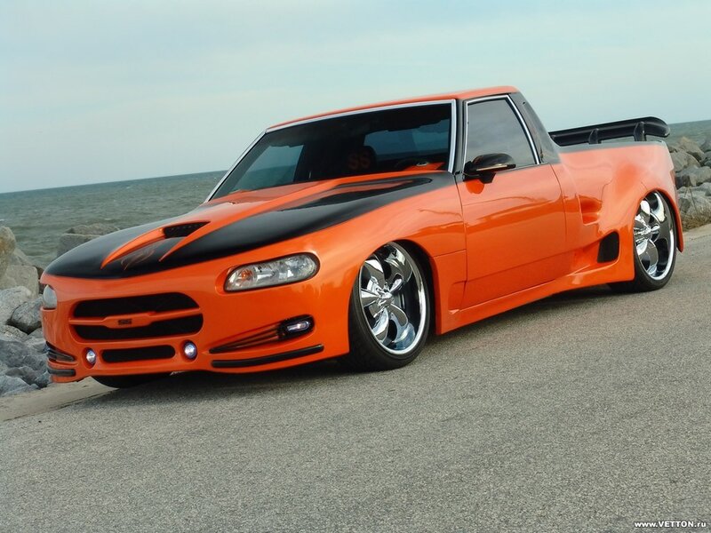 Orange Custom Pickup Truck — Dramatic, Afternoon, Photograph, Ocean, Rocks