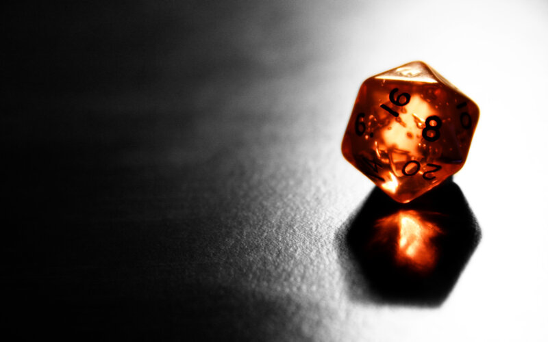 orange die on dark surface