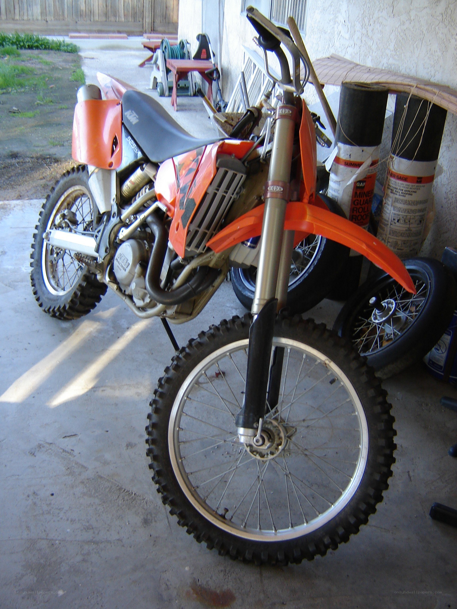 orange dirt bike in garage