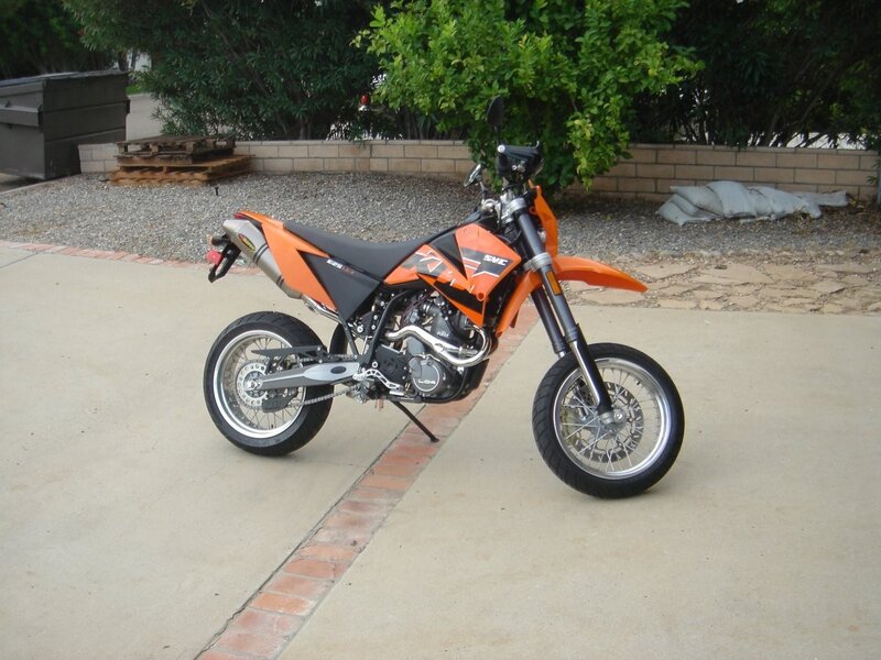 orange dirt bike on driveway