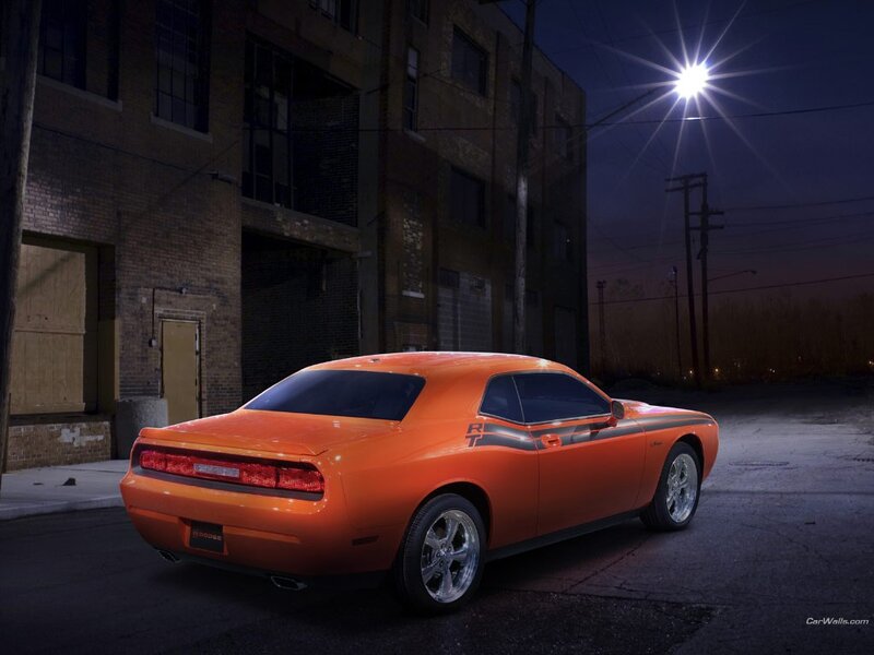 Orange Dodge Challenger at night