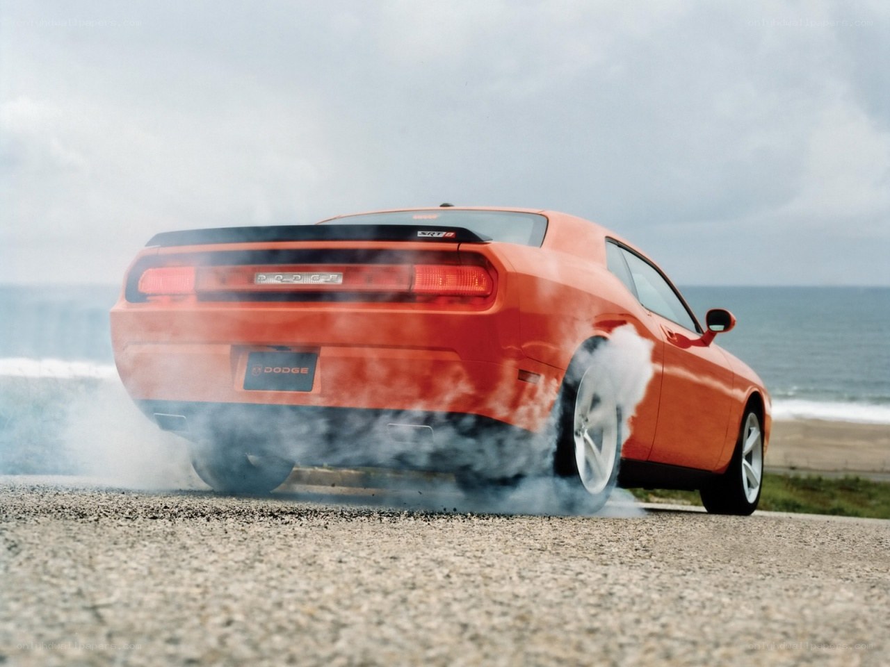 Orange Dodge Challenger burnout
