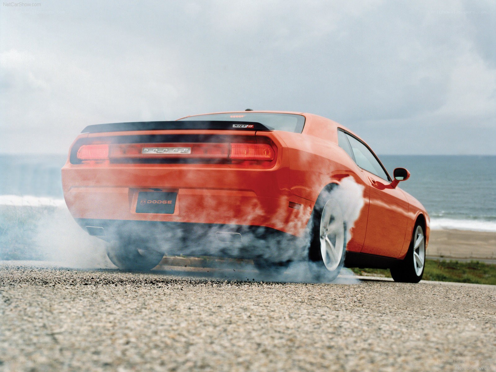 Orange Dodge Challenger burnout