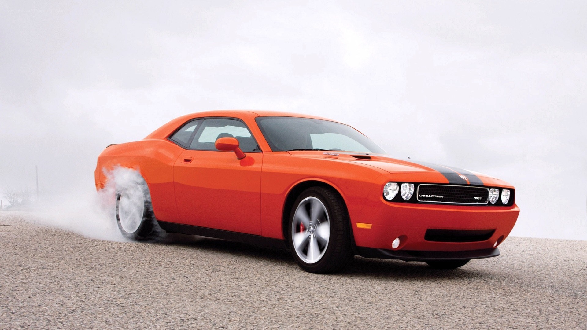 Orange Dodge Challenger burnout