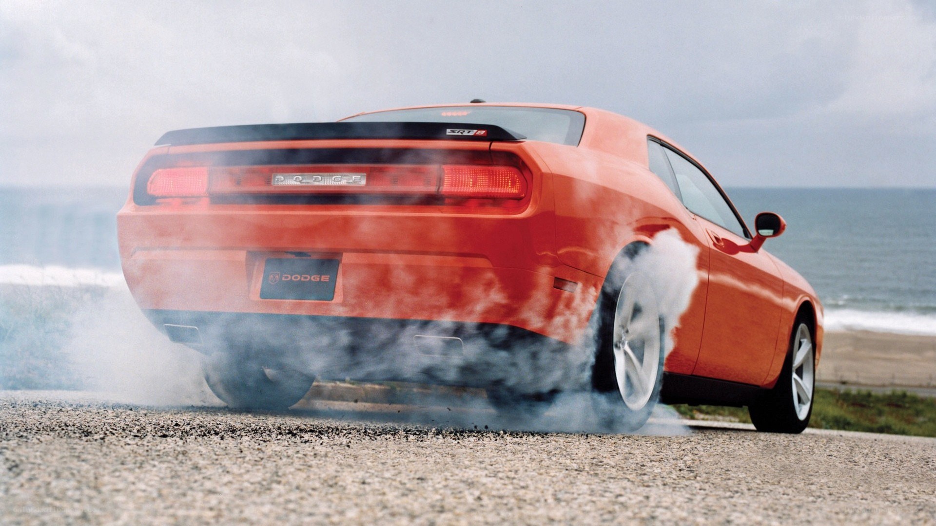 Orange Dodge Challenger burnout