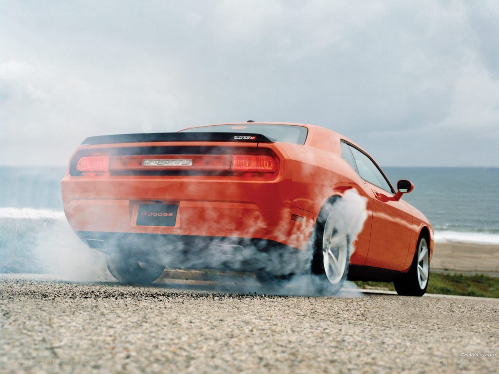 Orange Dodge Challenger burnout