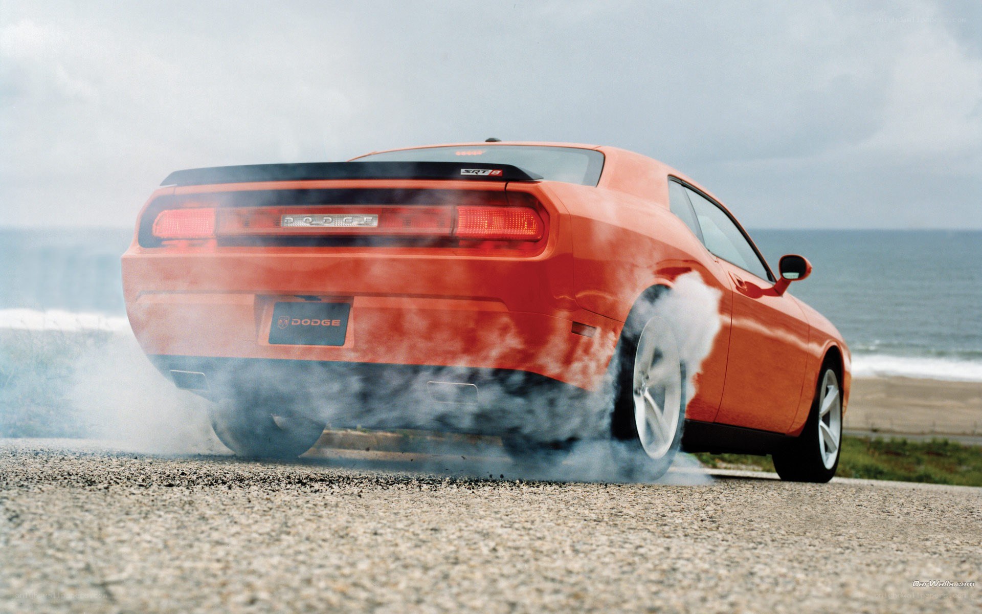 Orange Dodge Challenger burnout