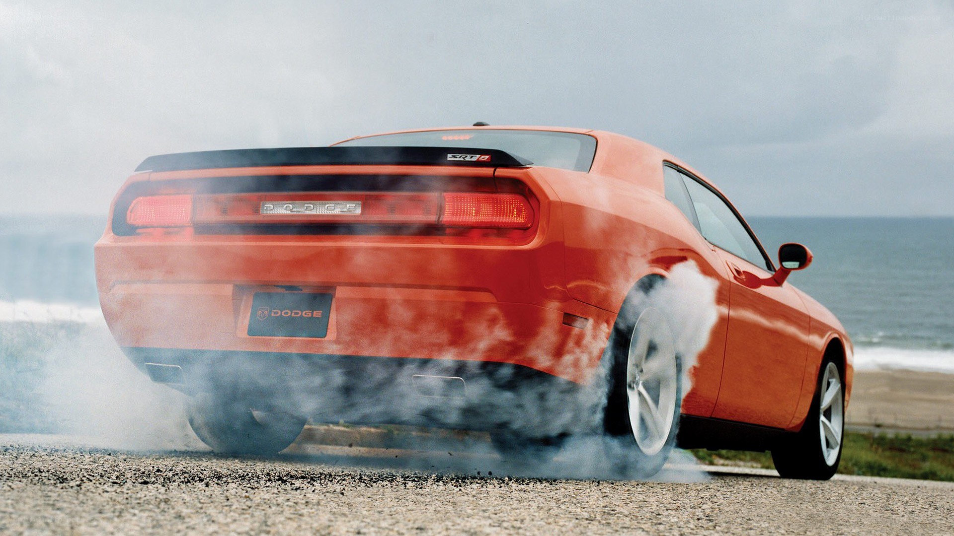 Orange Dodge Challenger burnout