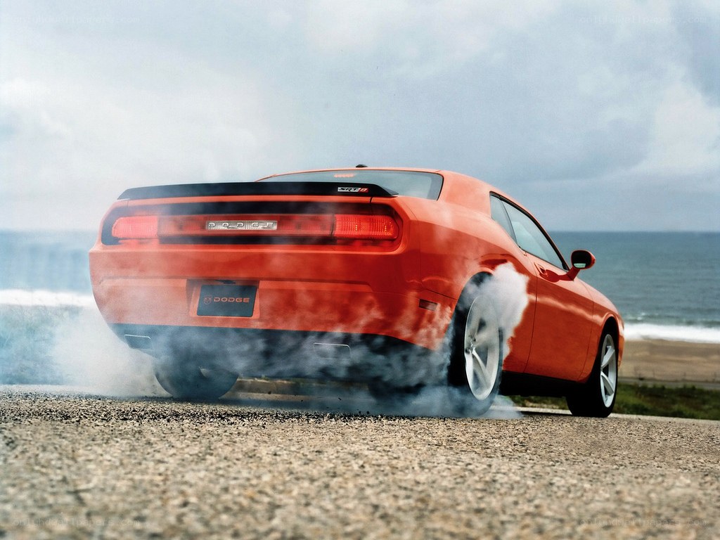 Orange Dodge Challenger burnout