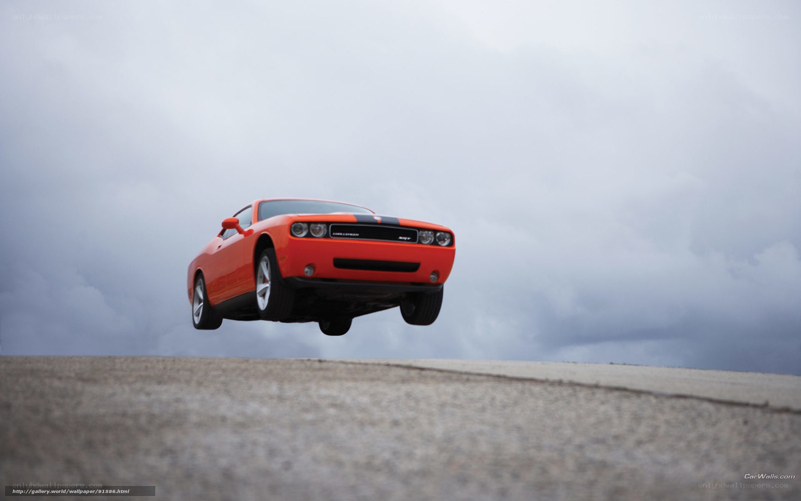 Orange Dodge Challenger in mid-air