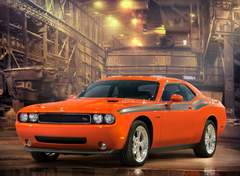 Orange Dodge Challenger in warehouse