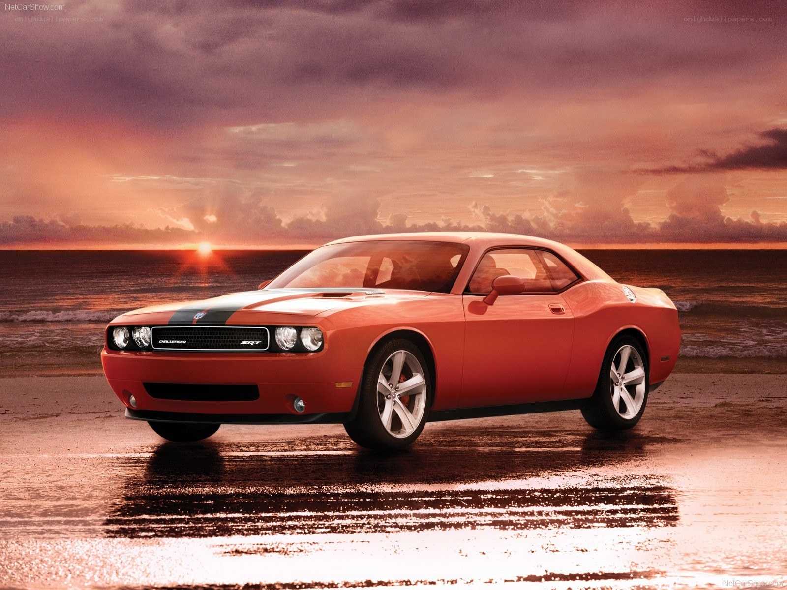 Orange Dodge Challenger on beach