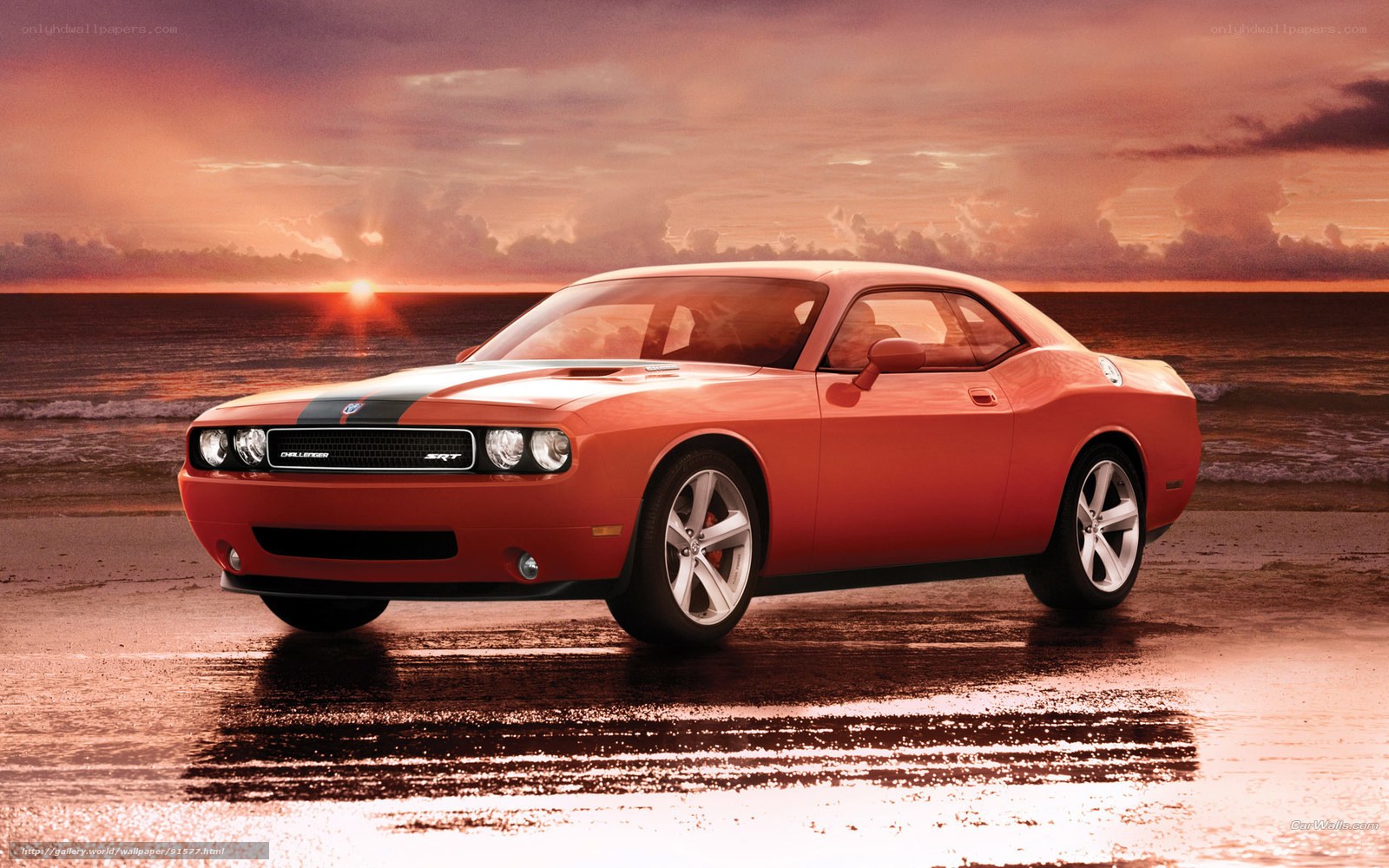 Orange Dodge Challenger on beach