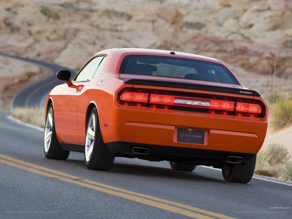 Orange Dodge Challenger on road