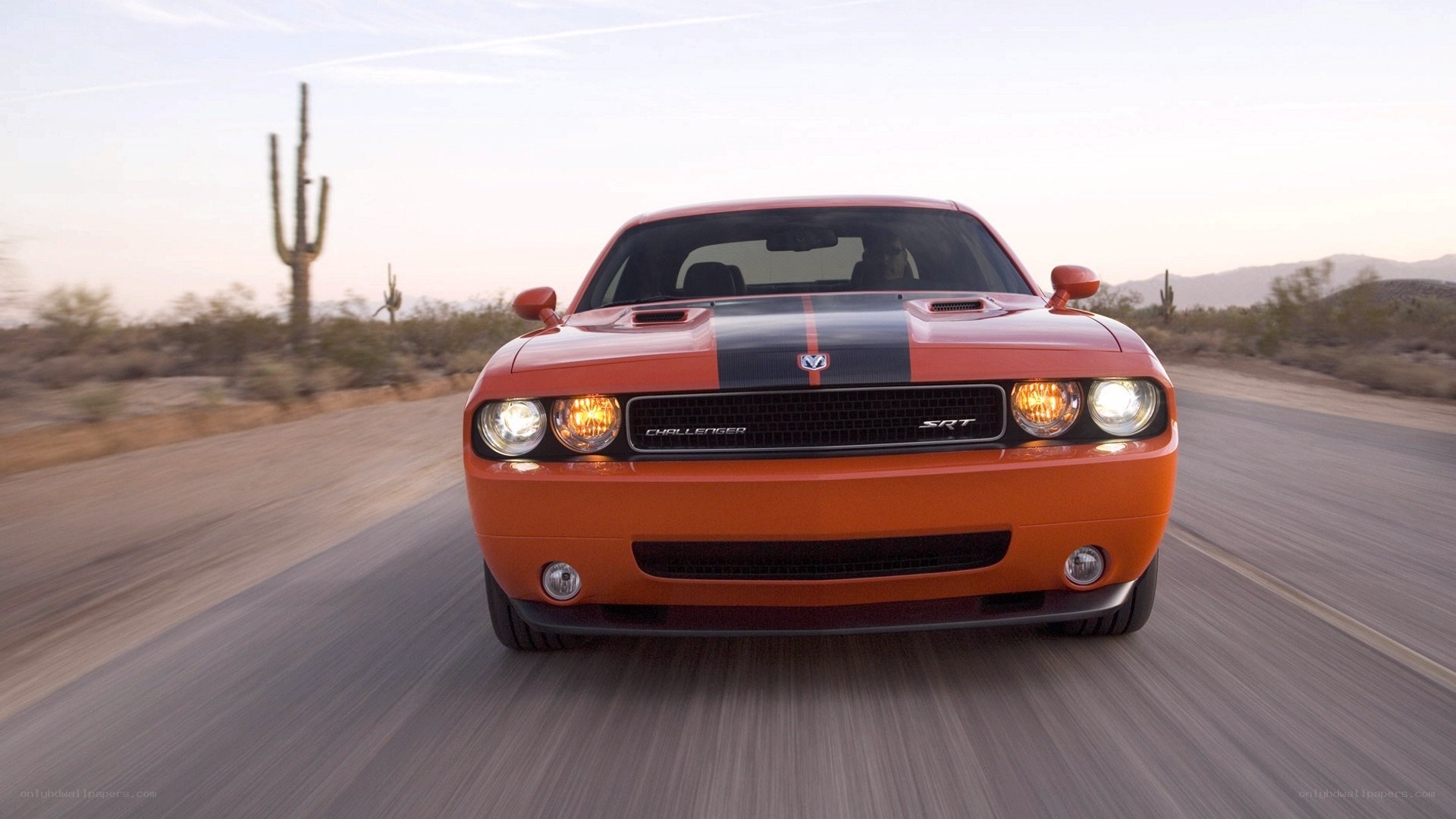 Orange Dodge Challenger SRT driving