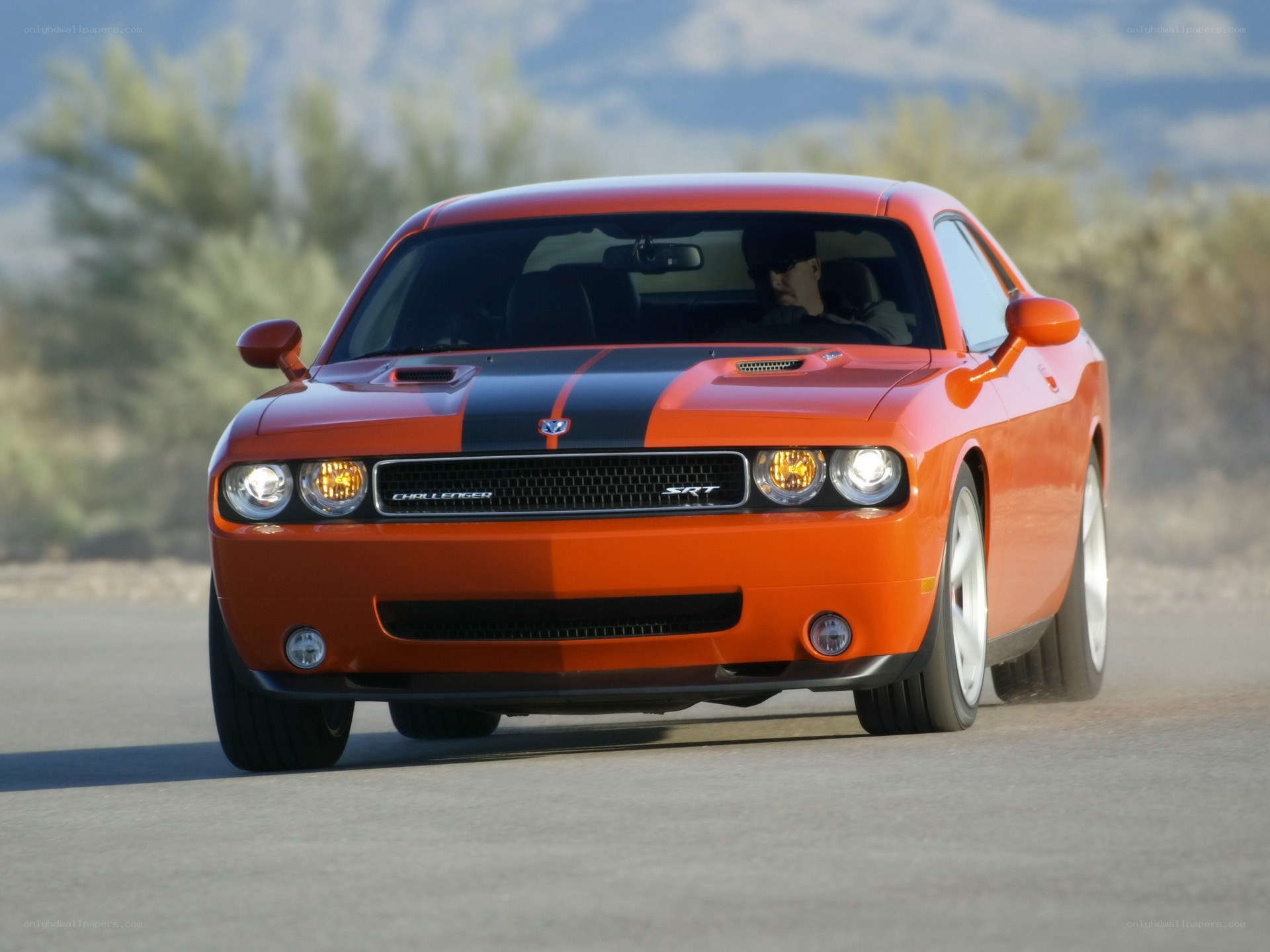 Orange Dodge Challenger SRT driving