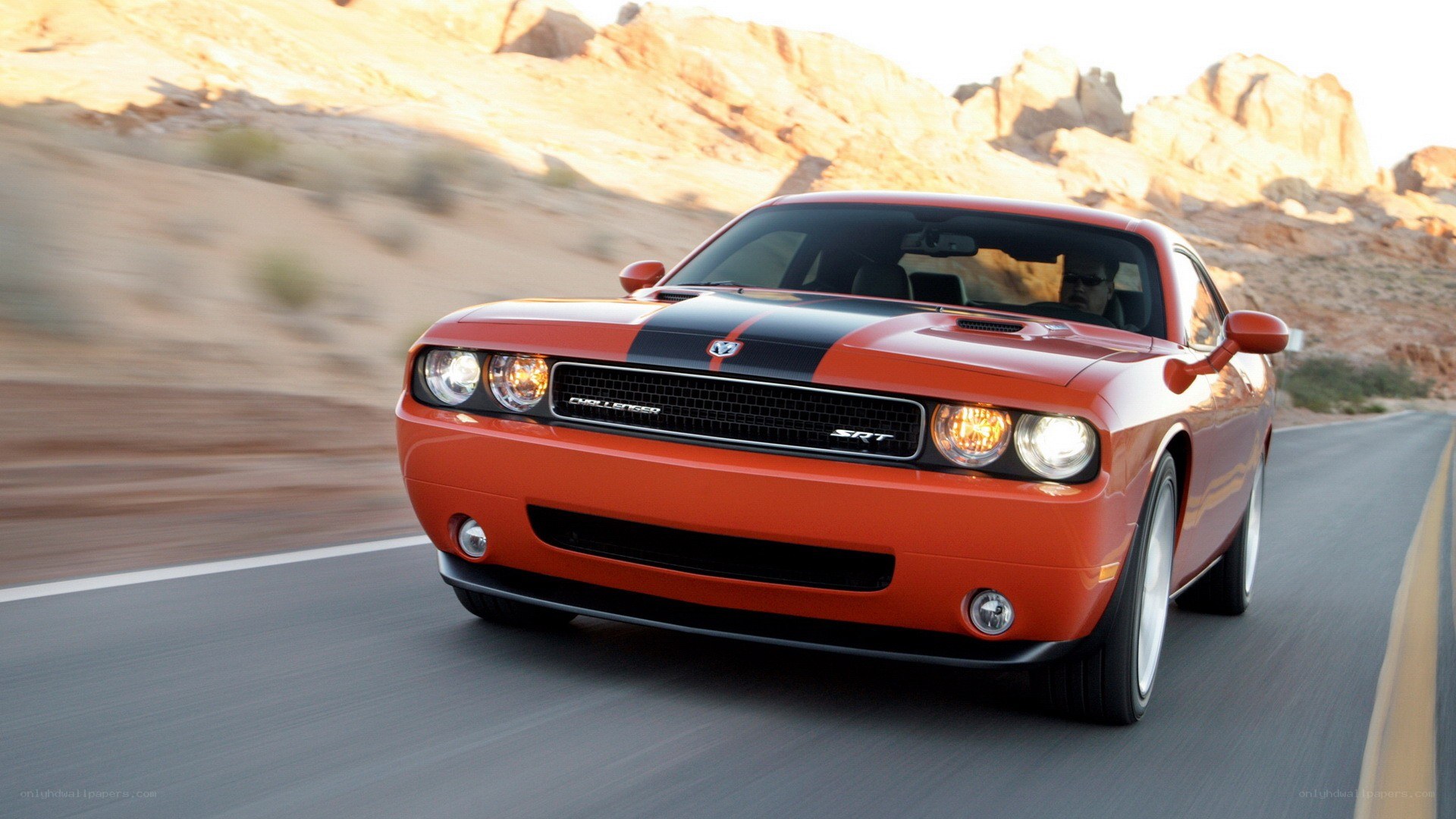 Orange Dodge Challenger SRT driving