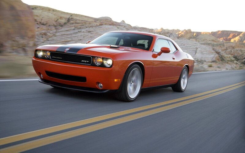 Orange Dodge Challenger SRT driving