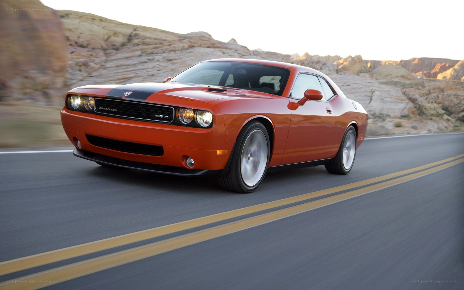Orange Dodge Challenger SRT driving