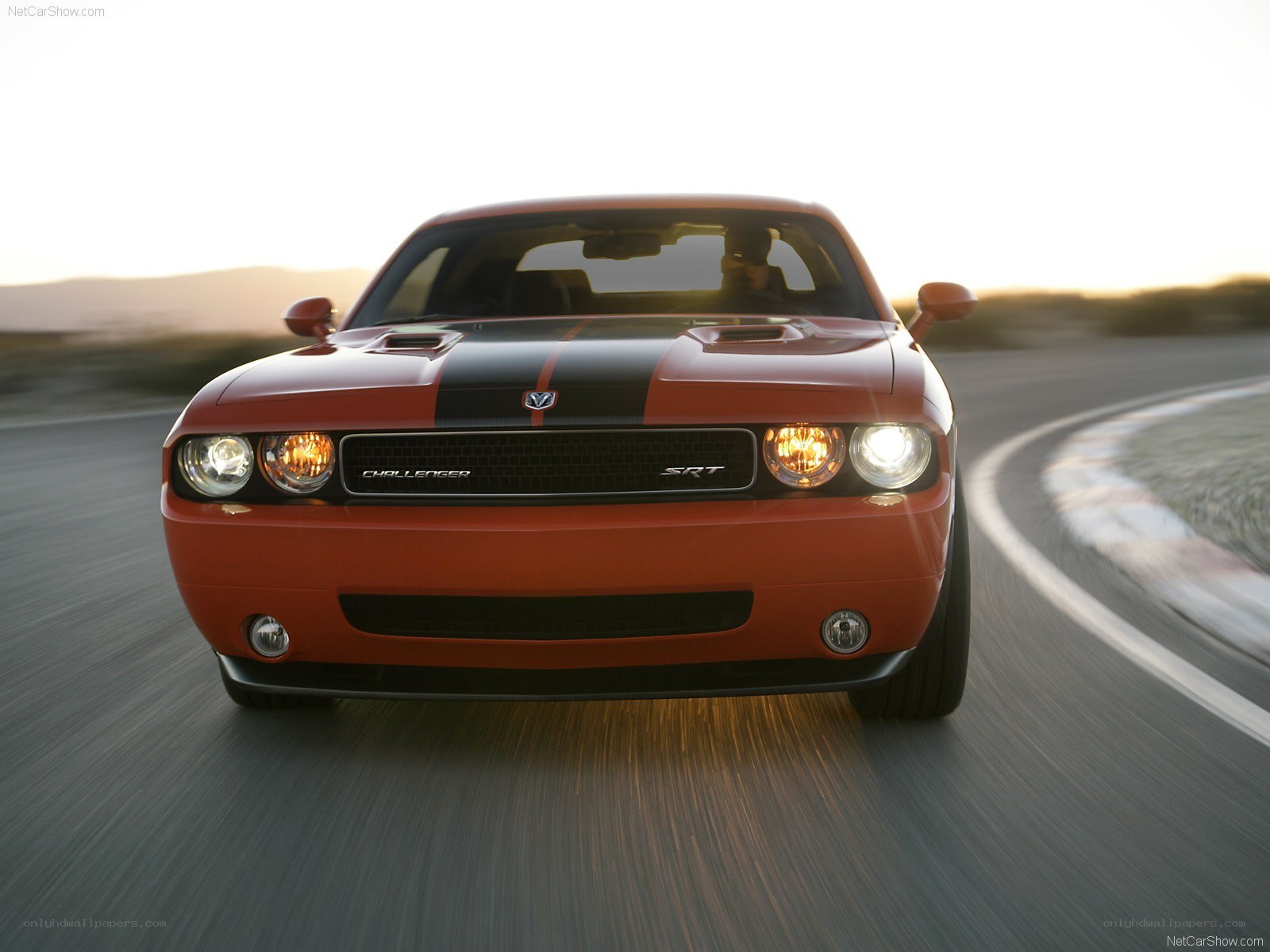 Orange Dodge Challenger SRT in motion