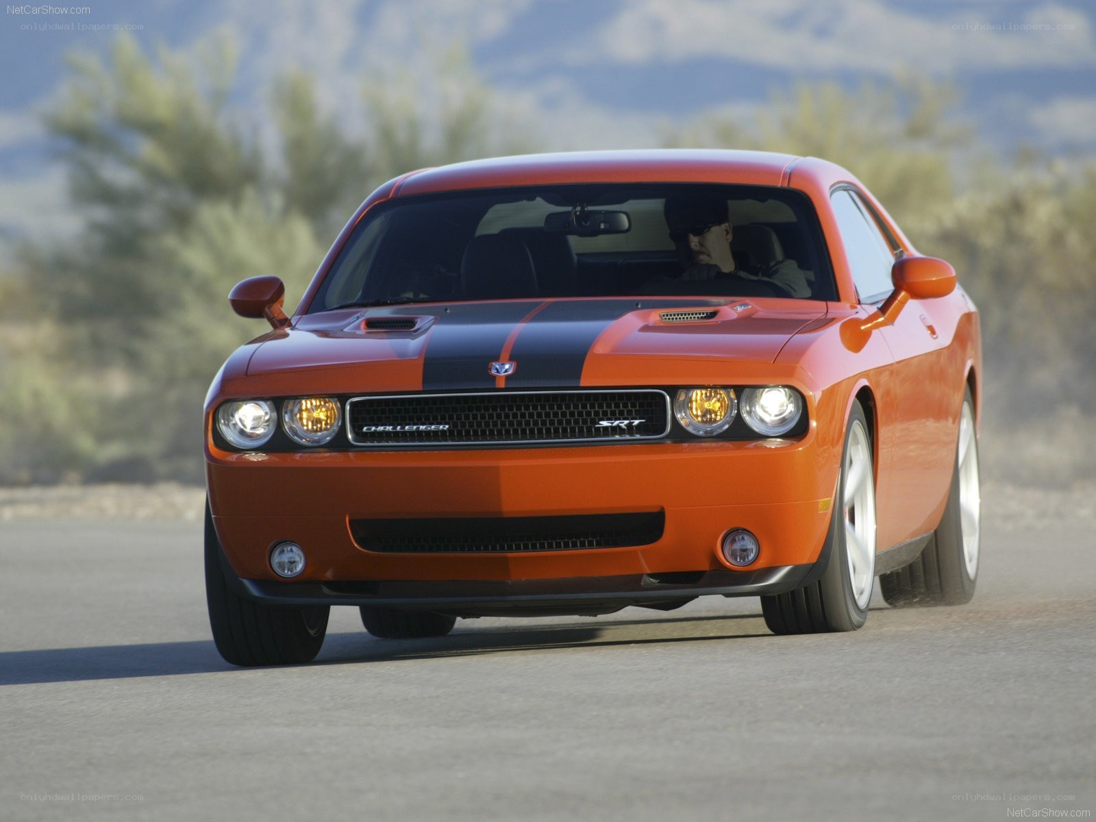 Orange Dodge Challenger SRT in motion