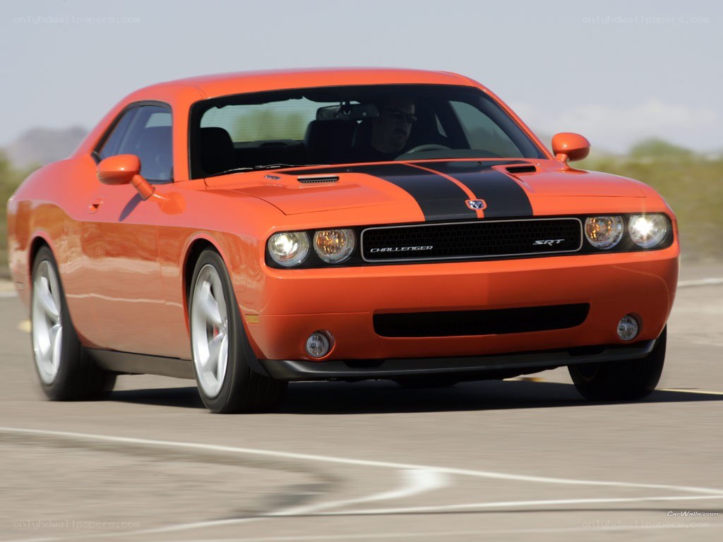 Orange Dodge Challenger SRT in motion