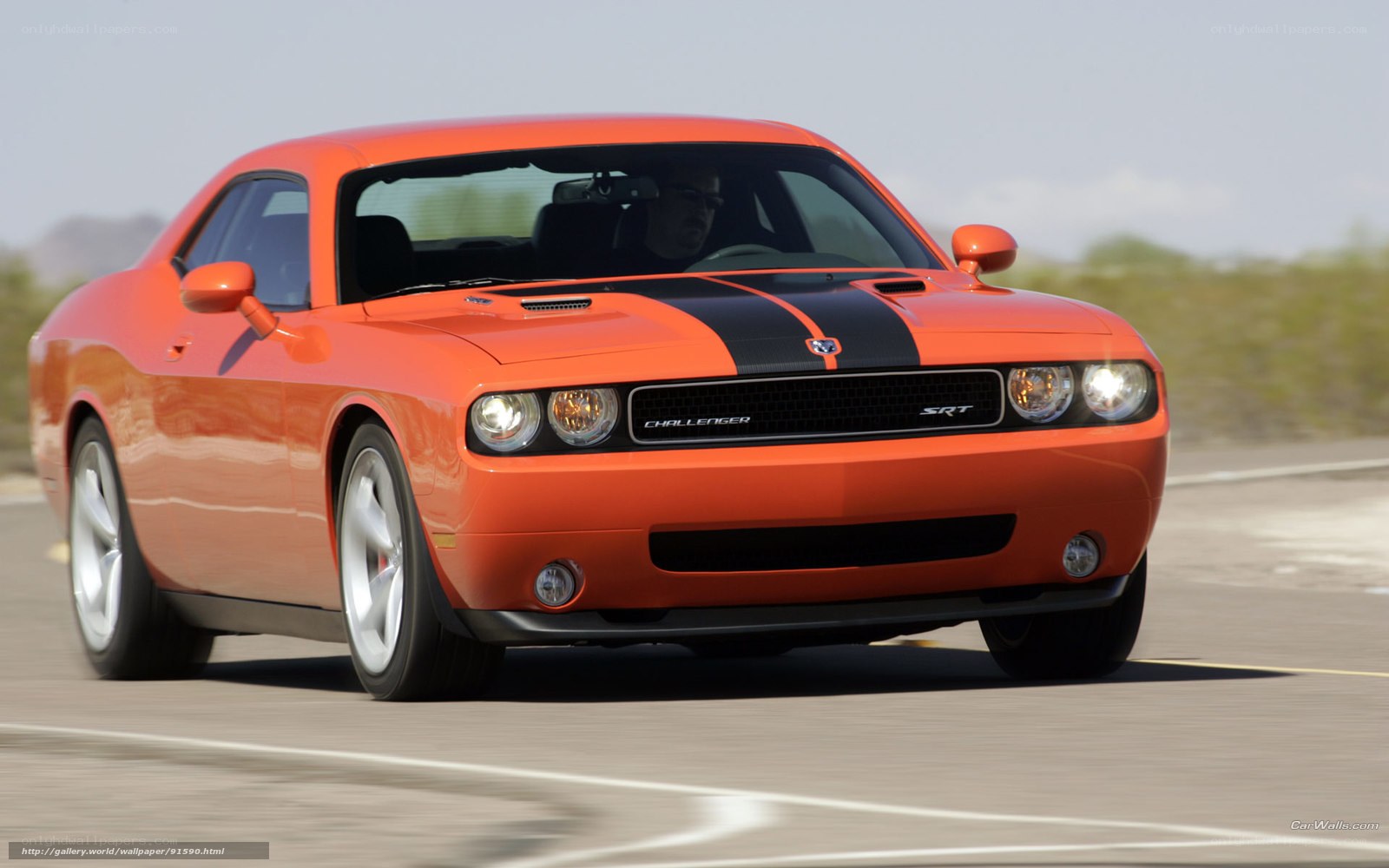Orange Dodge Challenger SRT in motion